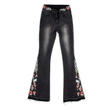 jean patte d'eph noir femme sur un cintre